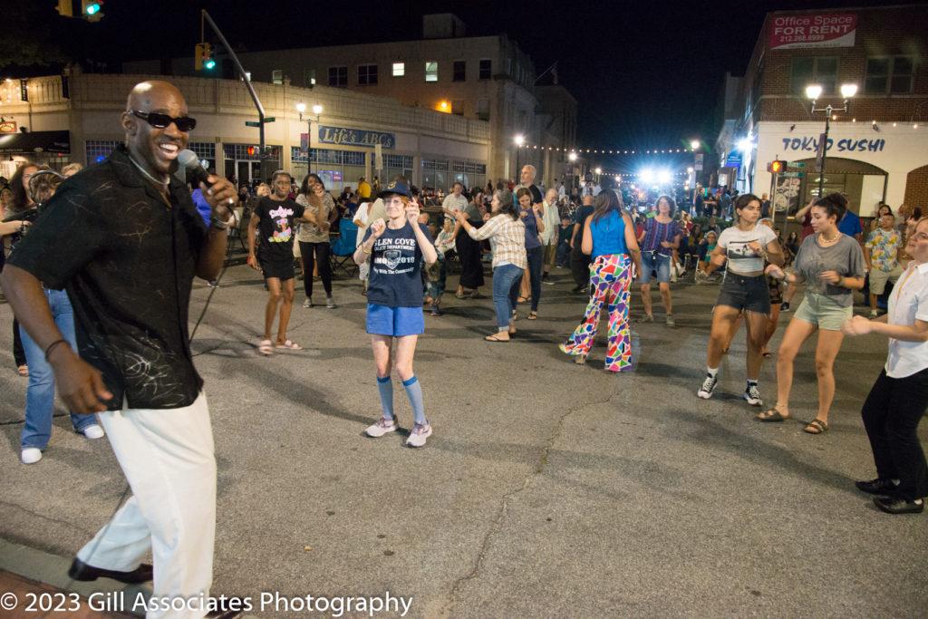 Forever Ray steps into the downtown streets to sing and dance with attendees