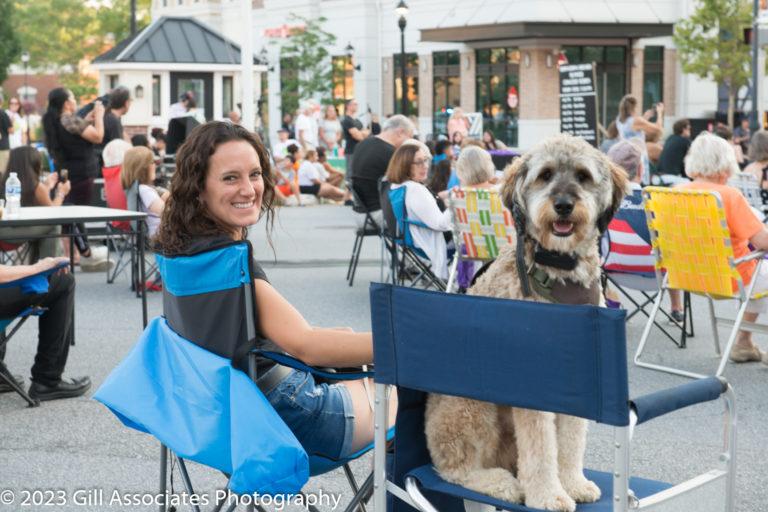 Audience member and their dog enjoying Downtown Sounds