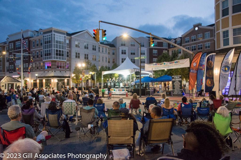 People gather downtown to listen to Forever Ray