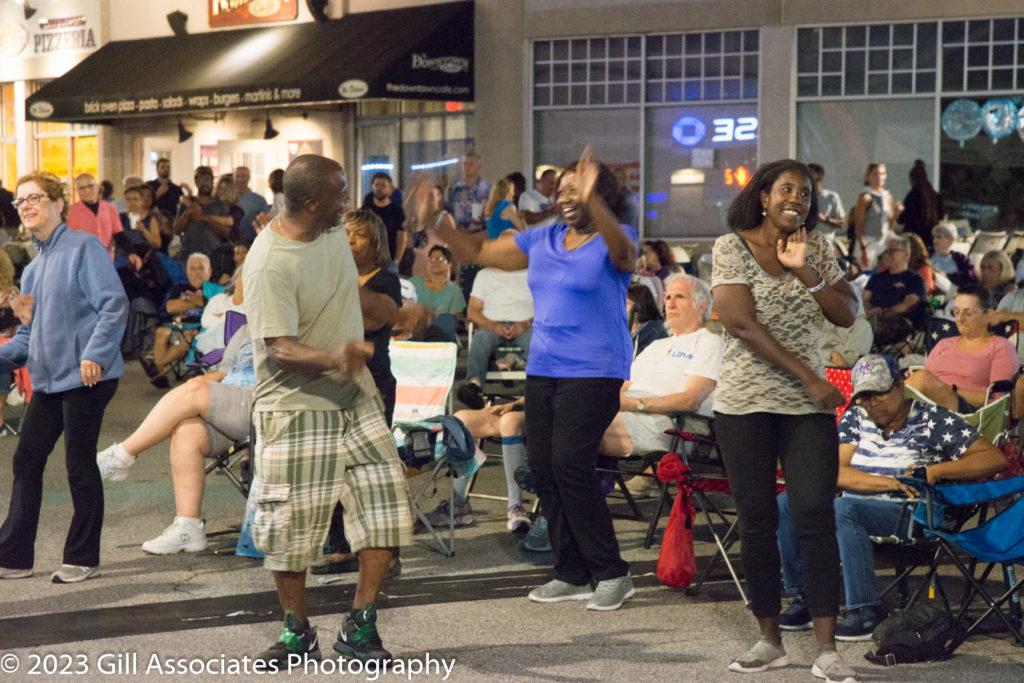 People dancing to Forever Ray at Downtown Sounds