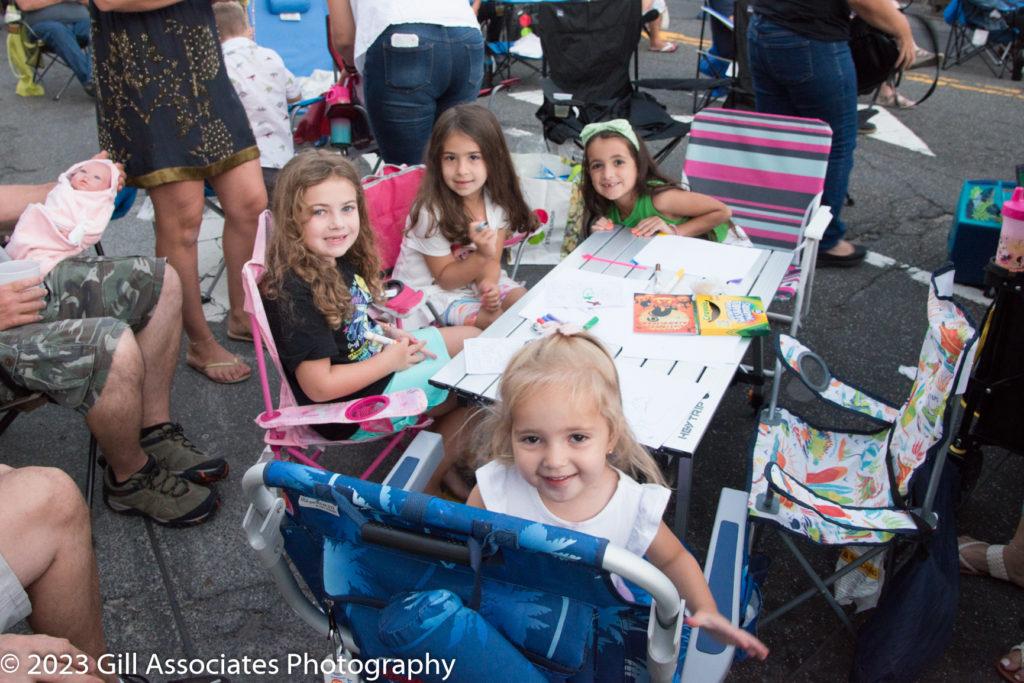 Kids hanging out and listening to Arena Rock downtown