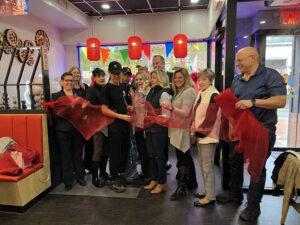 Kiko Ramen owner, Kenny Li, cuts the ribbon
